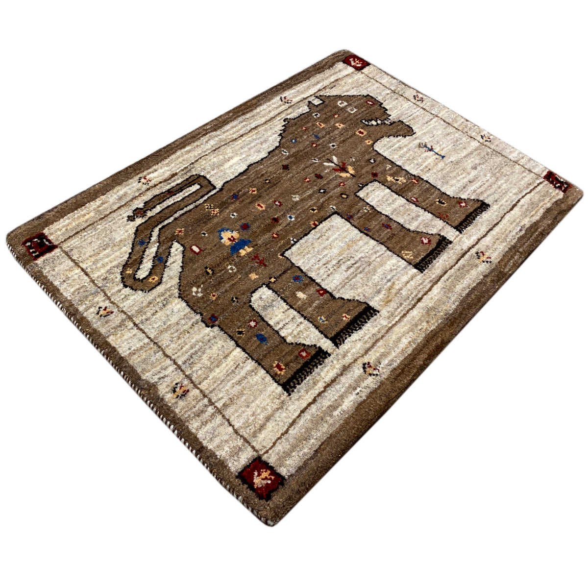 Gabbeh rug corner view with lion figure and decorative dots, beige-brown