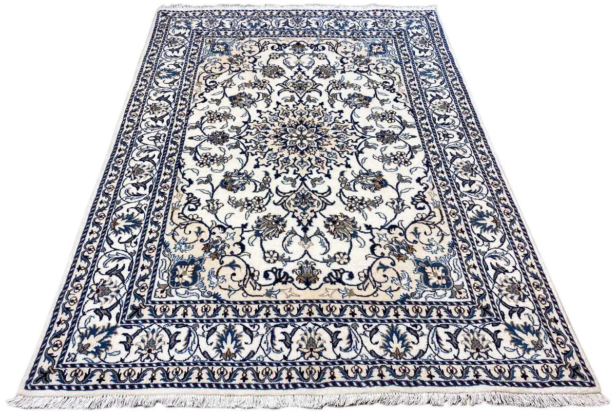 Rectangular Nain rug with blue-and-white Baroque ornaments, decorative border, and pile look.