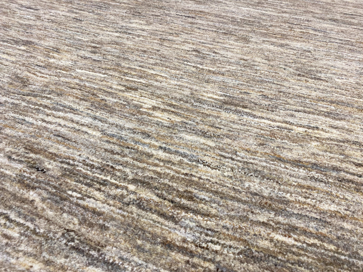 Gabbeh rug, richly detailed pile: beige-gray fibers with fine, irregular lines