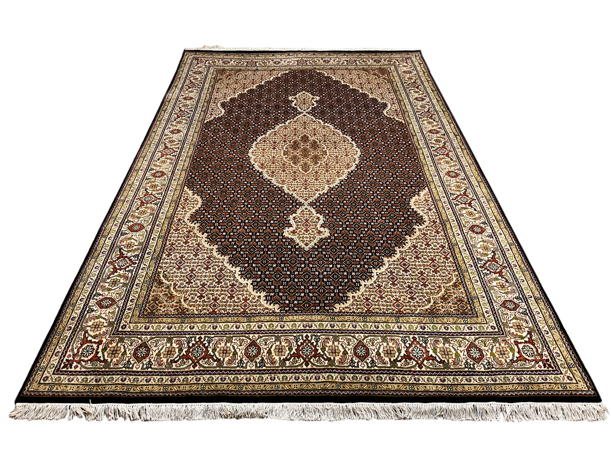 Brown Indo-Tabriz rug with a large medallion and ornamental border, brown/beige