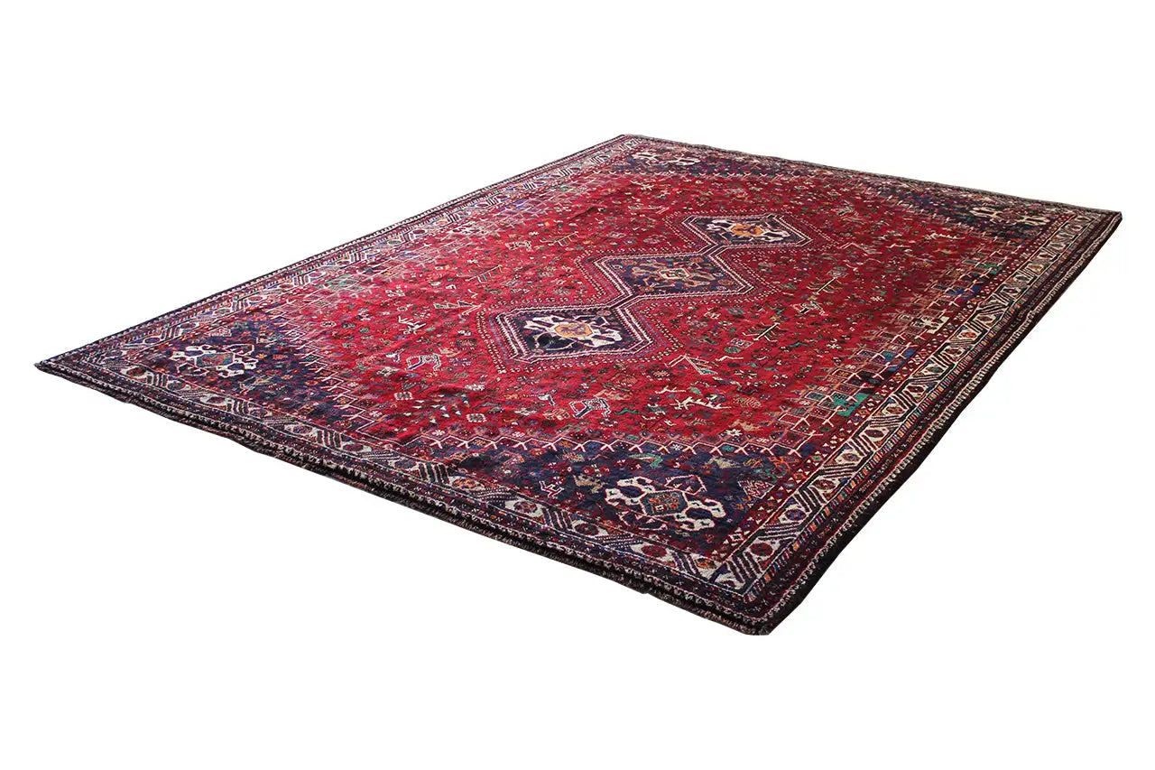 Rug with a red background and oriental pattern, folded rectangularly