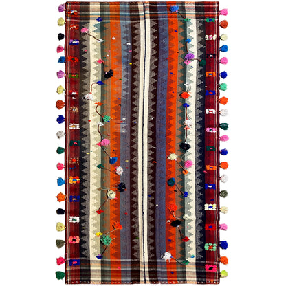 Wohnzimmer bunter Jajim Teppich handgewebt mit geometrischem Streifenmuster und Troddeln