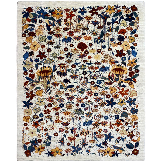 Rectangular Gabbeh-Luri rug with a multicolored floral pattern on a light background