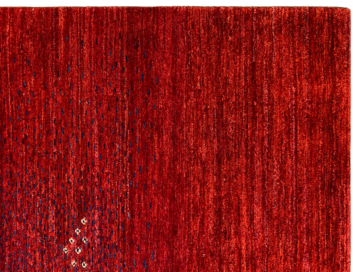 Red carpet close-up: dense pile with short fibers and an even surface