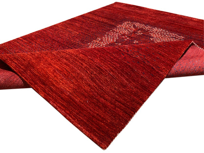 Red carpet with turned-up edge and medallion design, side view