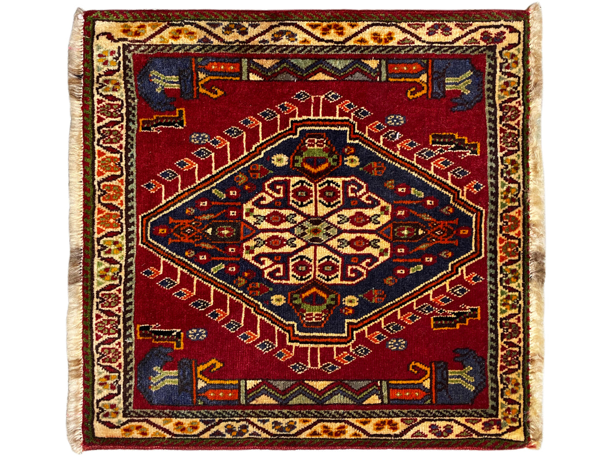 Poshti rug (59×61 cm), square, with a red ornamental rug motif and light-colored fringes