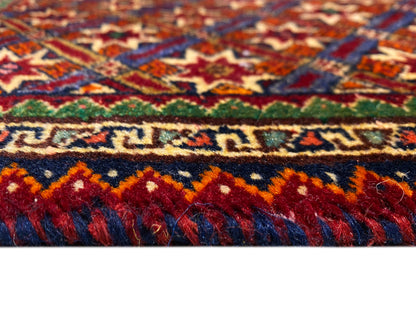 Poshti rug 62x52 cm close-up: colored stripes and high-pile fringes.