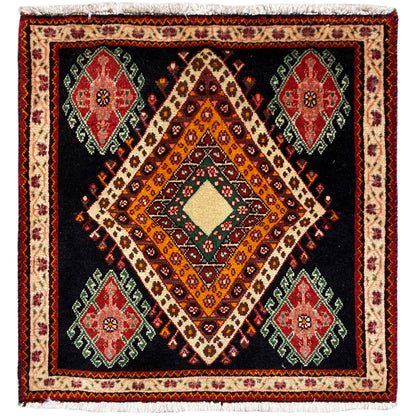 Poshti rug in a rectangular format with a black background, a central diamond pattern, and colorful medallions