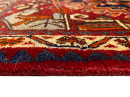 Carpet 65x59 cm close-up: red pile, surrounding border, and short fringes