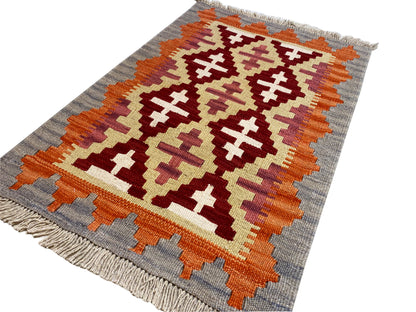 Flachgewebter Qashqai Kelim Teppich klein, rotes Muster mit Bordüre