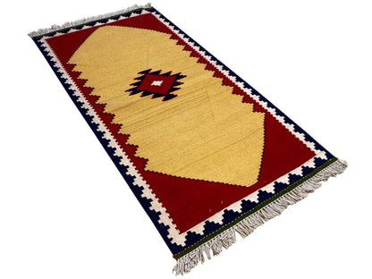 Ethno Kelim Teppich mit zentraler Raute in Rot, Blau und Beige